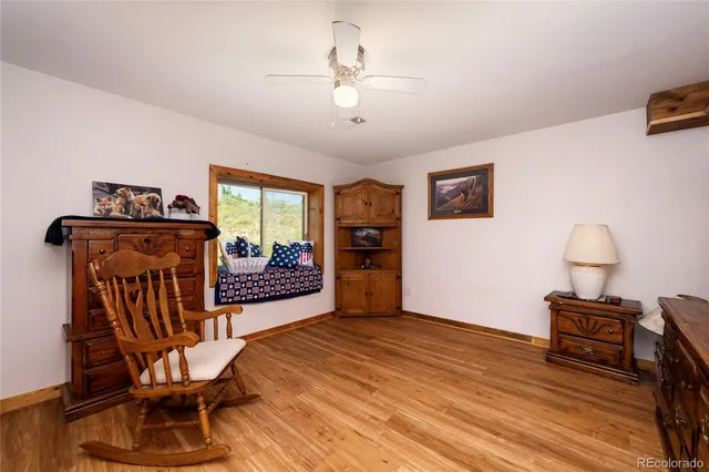 a view of a livingroom with furniture and a wooden floor