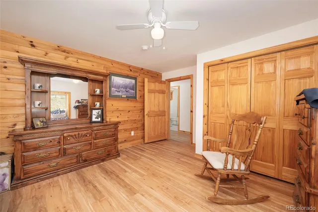 a living room with a furniture and a large window