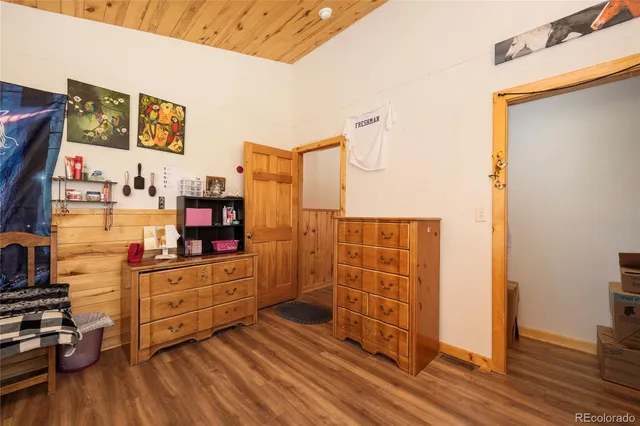 a room with wooden floors and furniture