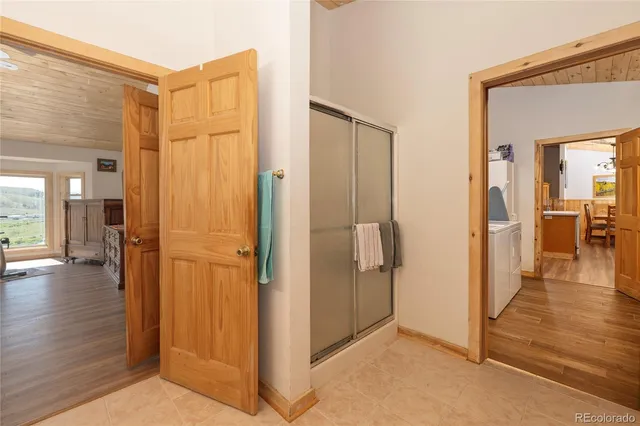 a view of a livingroom with furniture and hardwood floor