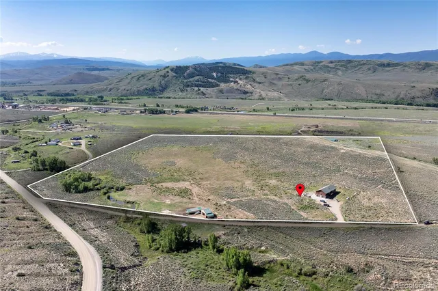 a view of roof with wooden floor and a floor to ceiling window
