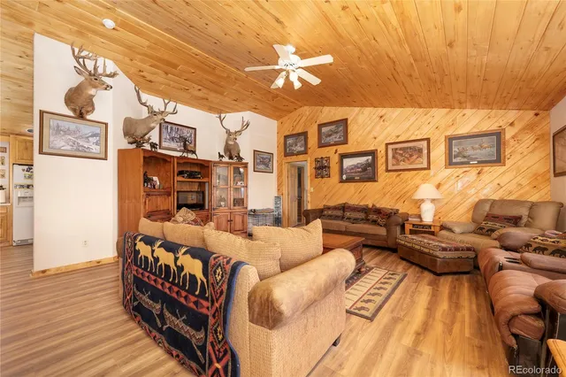 a theatre with furniture and wooden floor