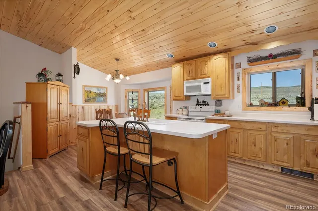 a kitchen with stainless steel appliances granite countertop a sink and cabinets