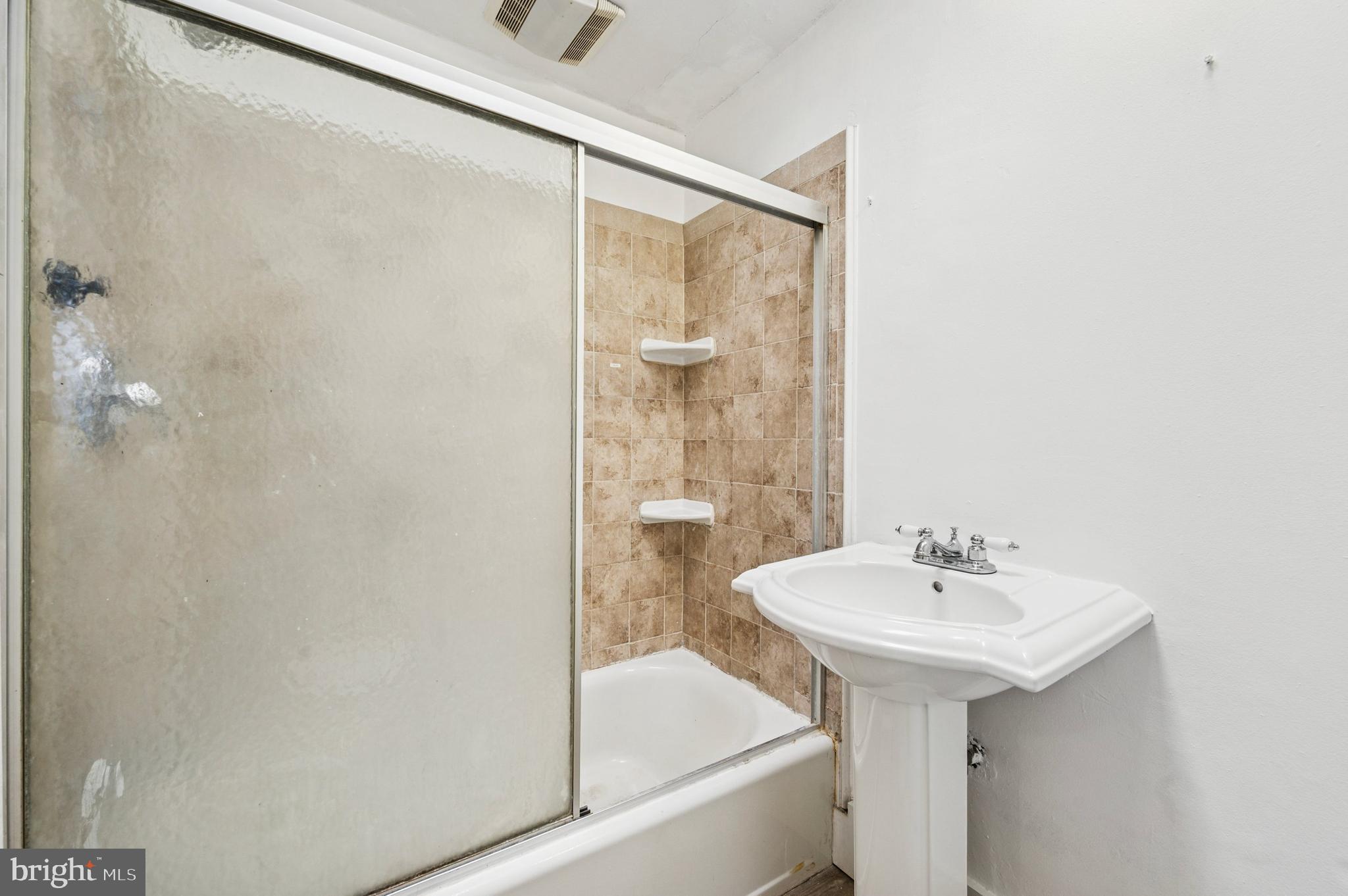 952 Grant Road Folcroft, PA 19032 - Photo 13 of 19 a bathroom with a sink and a mirror