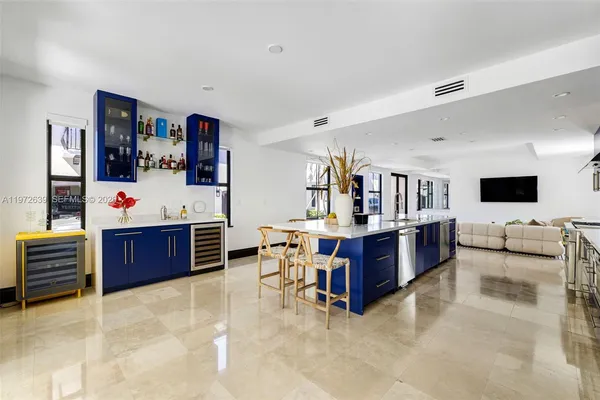 a living room with furniture and flat screen tv