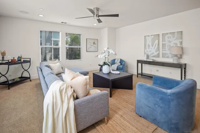 a living room with furniture and windows