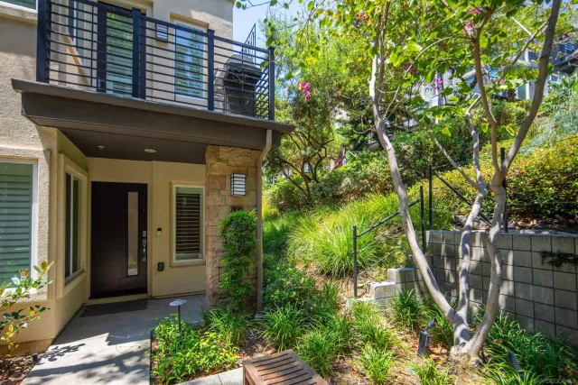 front view of a house with a tree