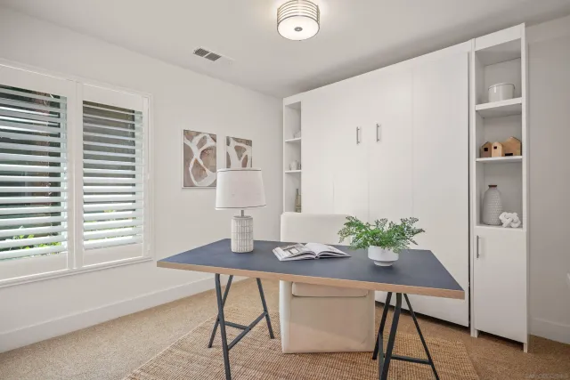 a workspace with furniture and window