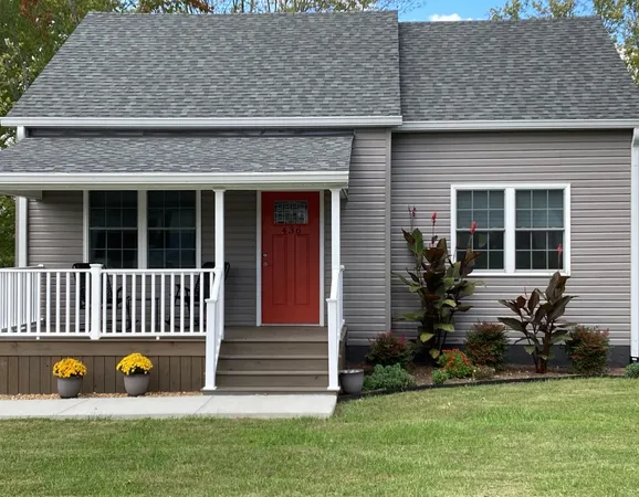 front view of a house with a yard