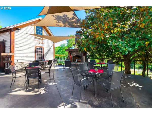 a view of a patio with table and chairs with wooden floor