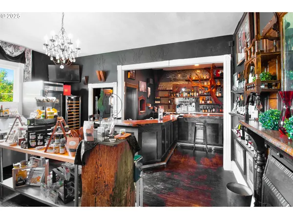 a living room with fireplace furniture and a chandelier