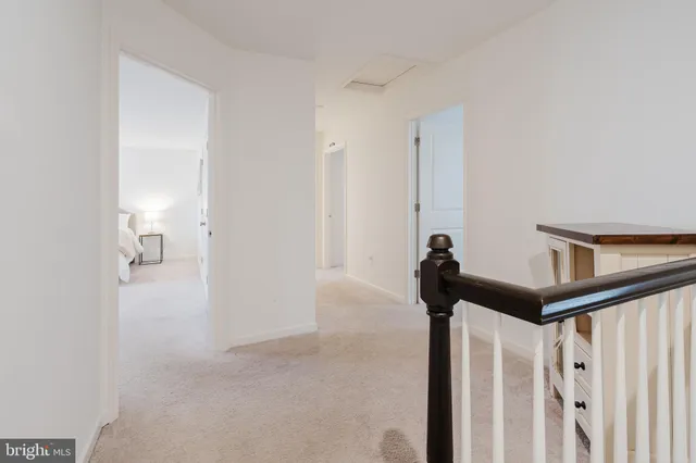 a spacious bedroom with a bed and a window