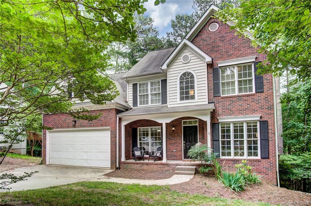 11121 Windgate Court Tega Cay, SC 29708 - Photo 1 of 44 a front view of a house with a yard and garage