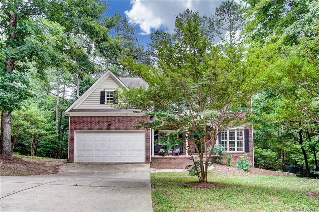 11121 Windgate Court Tega Cay, SC 29708 - Photo 2 of 44 a front view of a house with a yard and tree