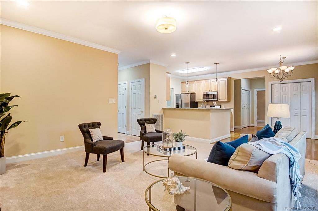 11121 Windgate Court Tega Cay, SC 29708 - Photo 12 of 44 a living room with furniture and kitchen view