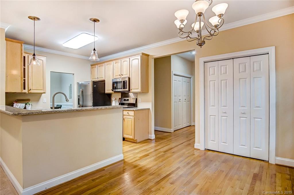 11121 Windgate Court Tega Cay, SC 29708 - Photo 13 of 44 a view of a kitchen with sink and wooden floor