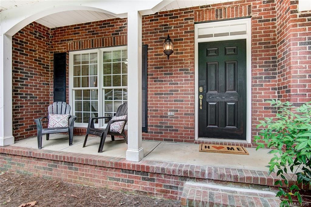 11121 Windgate Court Tega Cay, SC 29708 - Photo 3 of 44 a view of front door of house with outdoor seating