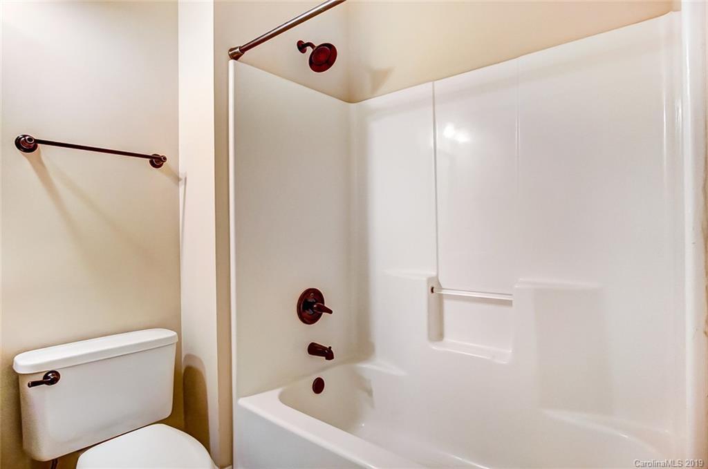 11121 Windgate Court Tega Cay, SC 29708 - Photo 25 of 44 a bathroom with a bathtub and shower