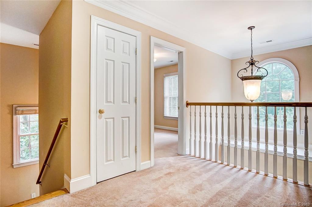 11121 Windgate Court Tega Cay, SC 29708 - Photo 27 of 44 a view of a livingroom with a staircase