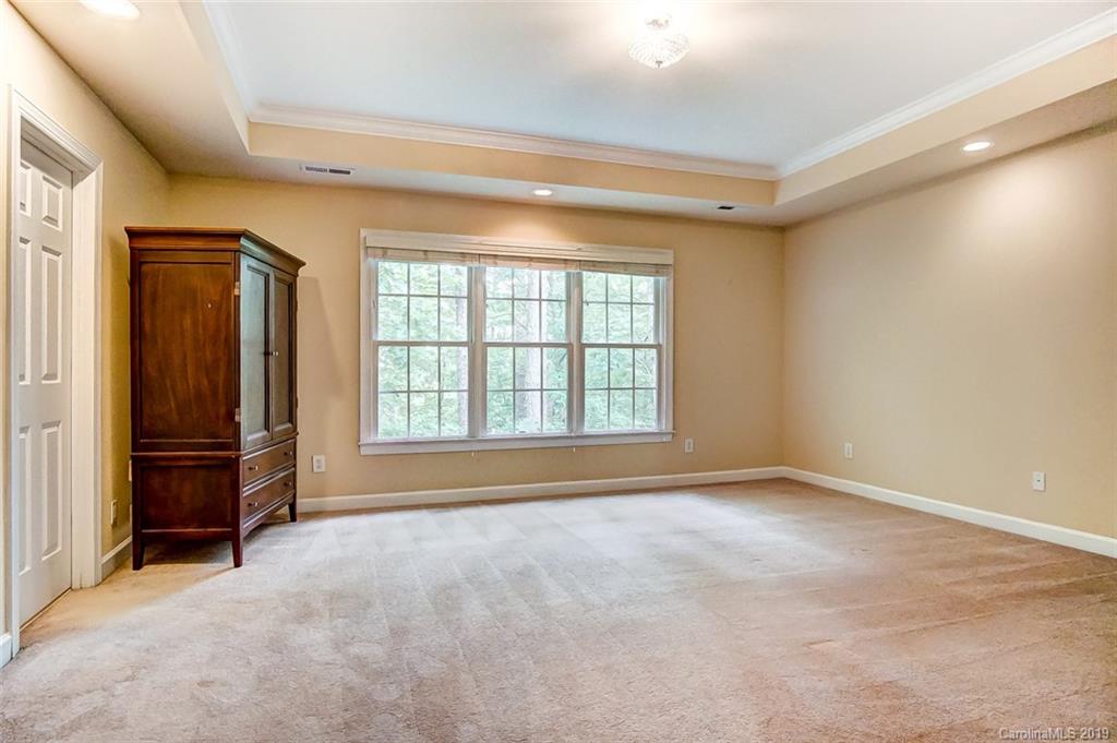 11121 Windgate Court Tega Cay, SC 29708 - Photo 28 of 44 an empty room with windows