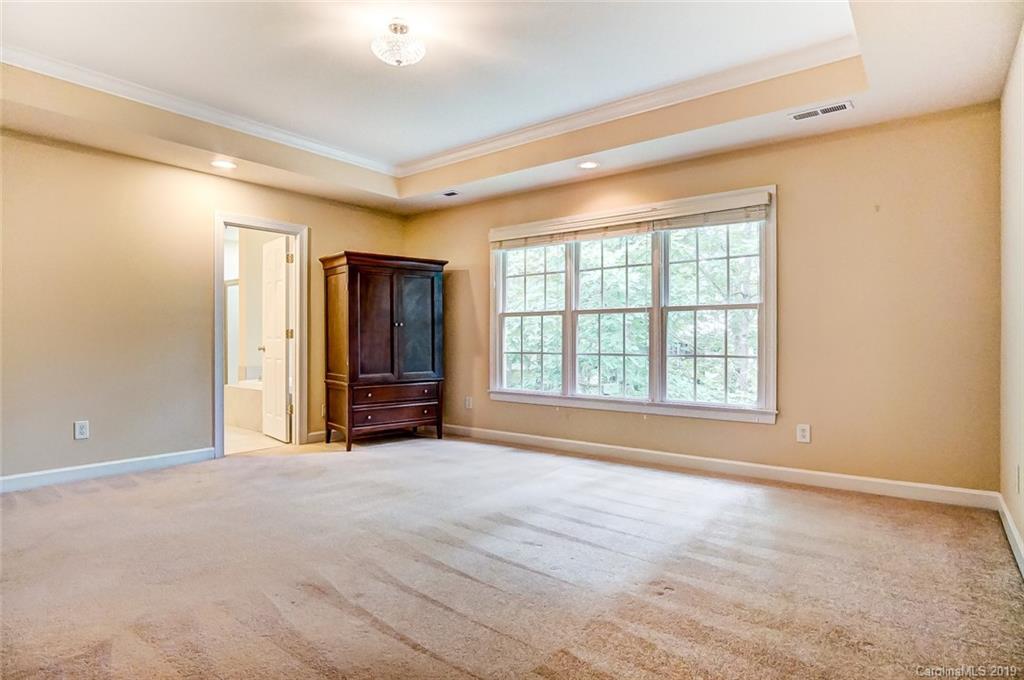 11121 Windgate Court Tega Cay, SC 29708 - Photo 29 of 44 a view of an empty room with a window