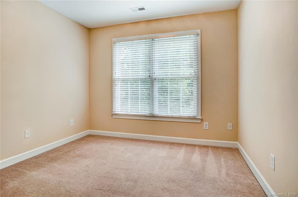 11121 Windgate Court Tega Cay, SC 29708 - Photo 34 of 44 an empty room with a window