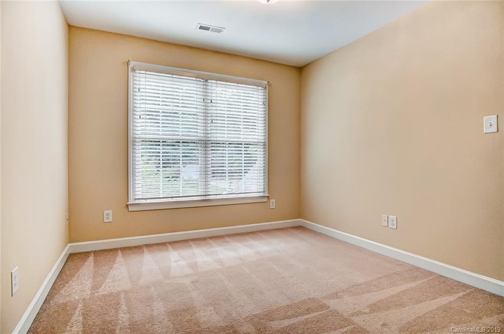 11121 Windgate Court Tega Cay, SC 29708 - Photo 36 of 44 a view of an empty room with a window