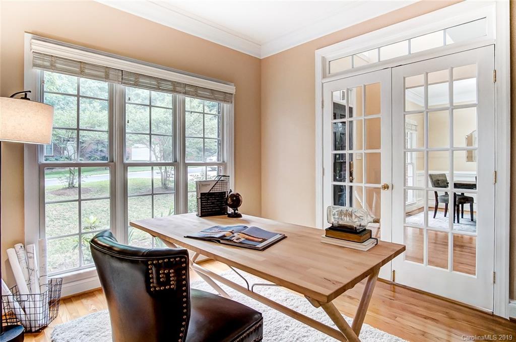 11121 Windgate Court Tega Cay, SC 29708 - Photo 6 of 44 a living room with a large window and dining table