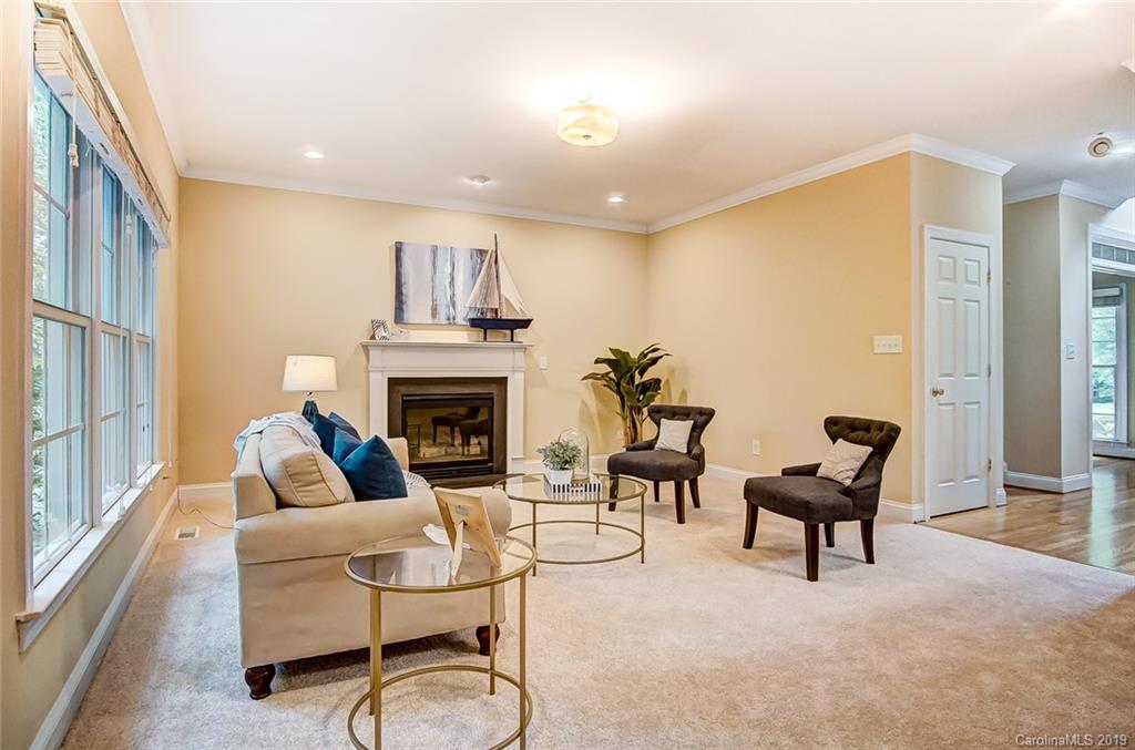 11121 Windgate Court Tega Cay, SC 29708 - Photo 10 of 44 a living room with furniture and a fireplace