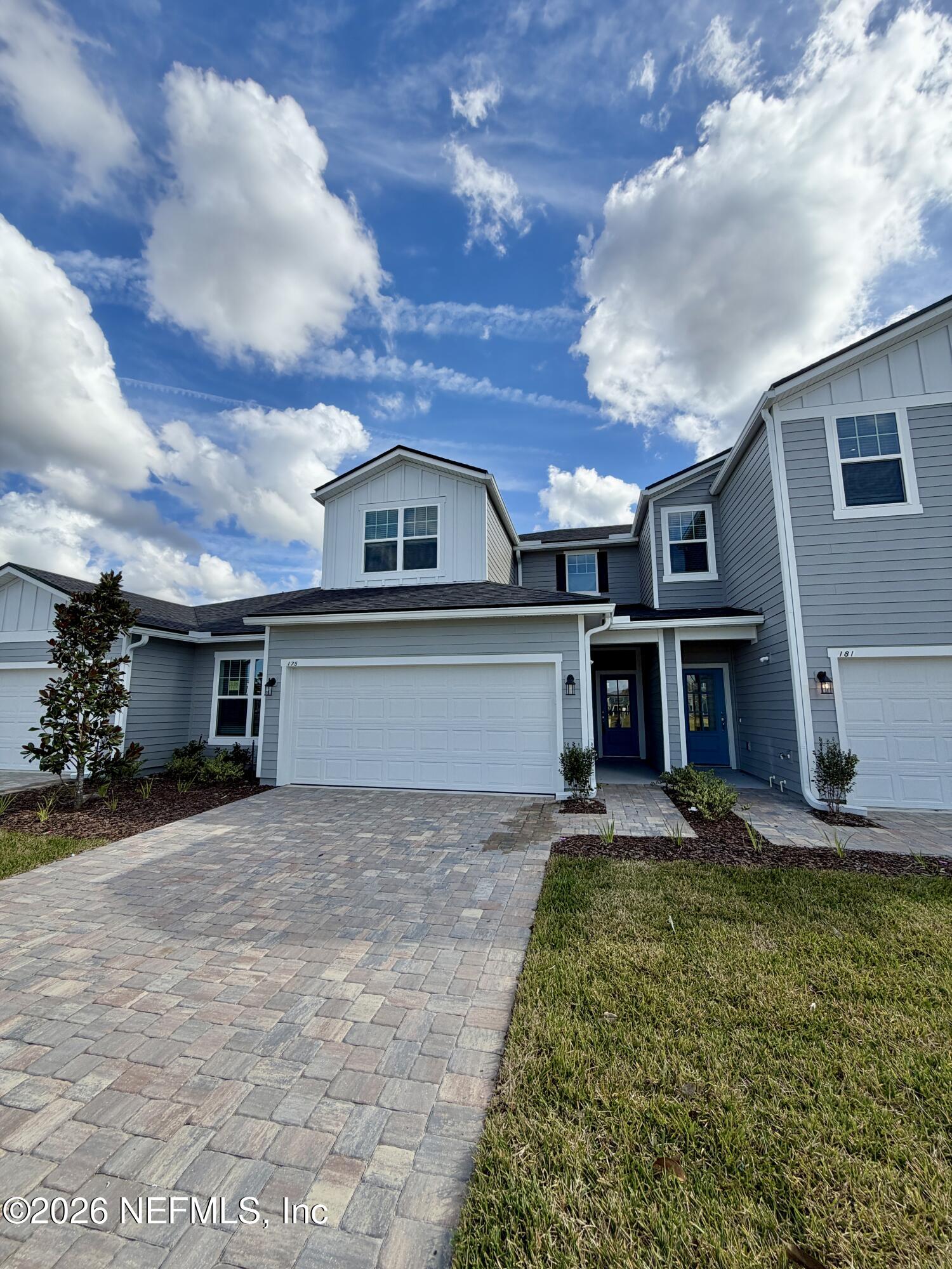 front view of a house with a yard