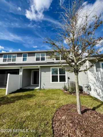 a view of a house with backyard