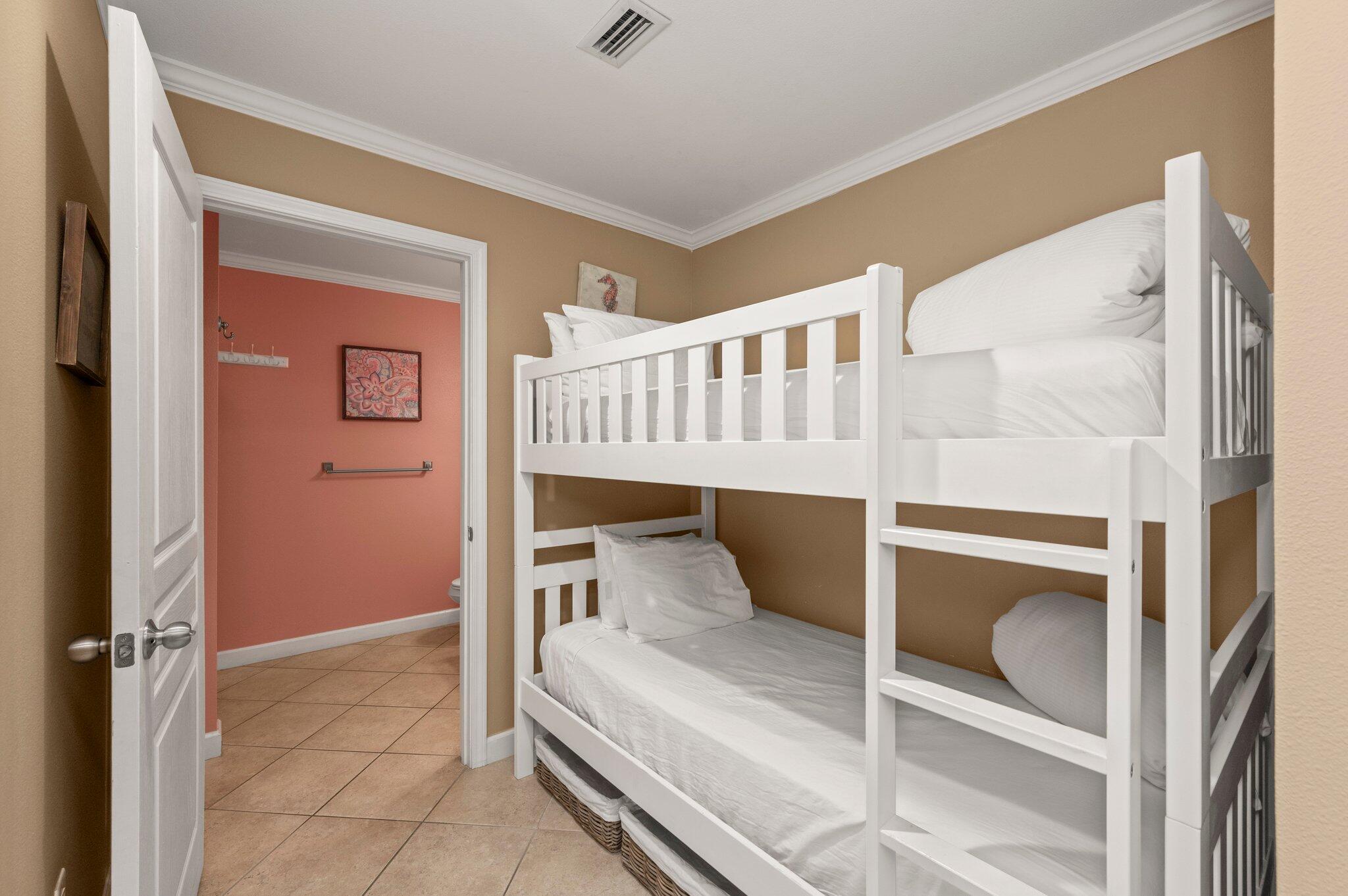 548 Sandy Cay Drive, Unit 203 Miramar Beach, FL 32550 - Photo 12 of 48 a bedroom with a bunk bed and a window