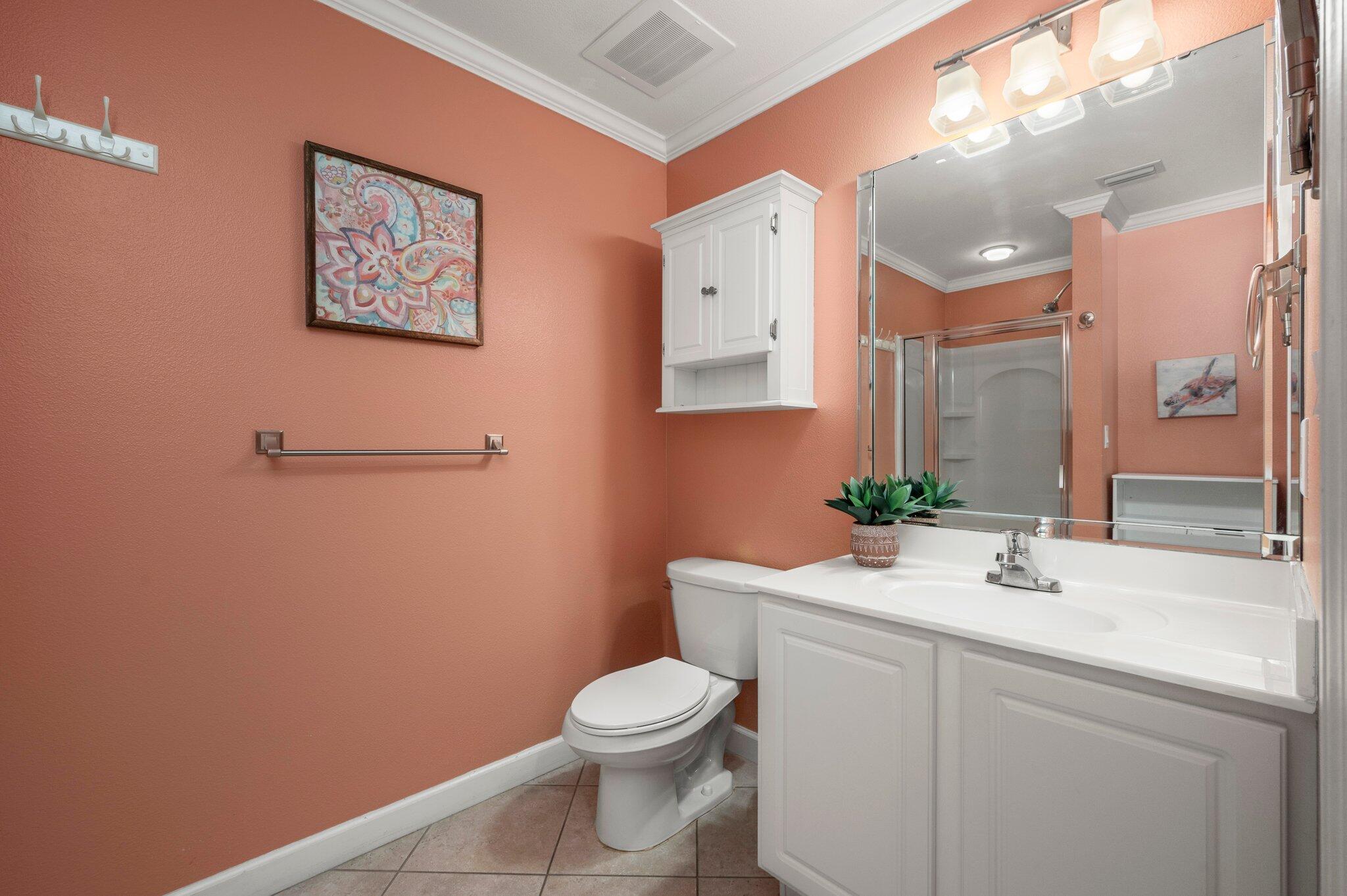 548 Sandy Cay Drive, Unit 203 Miramar Beach, FL 32550 - Photo 14 of 48 a bathroom with a toilet a sink and mirror