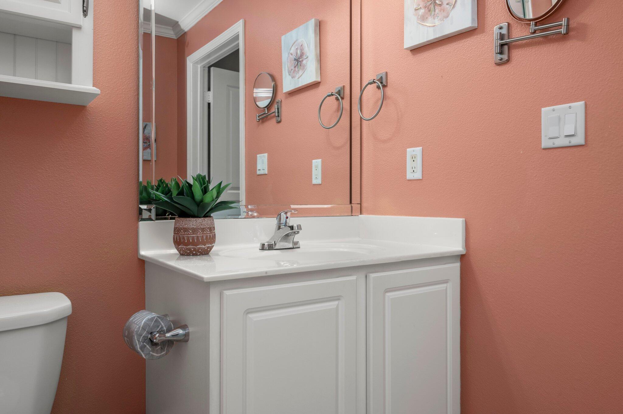 548 Sandy Cay Drive, Unit 203 Miramar Beach, FL 32550 - Photo 16 of 48 a bathroom with a granite countertop sink a toilet and a mirror