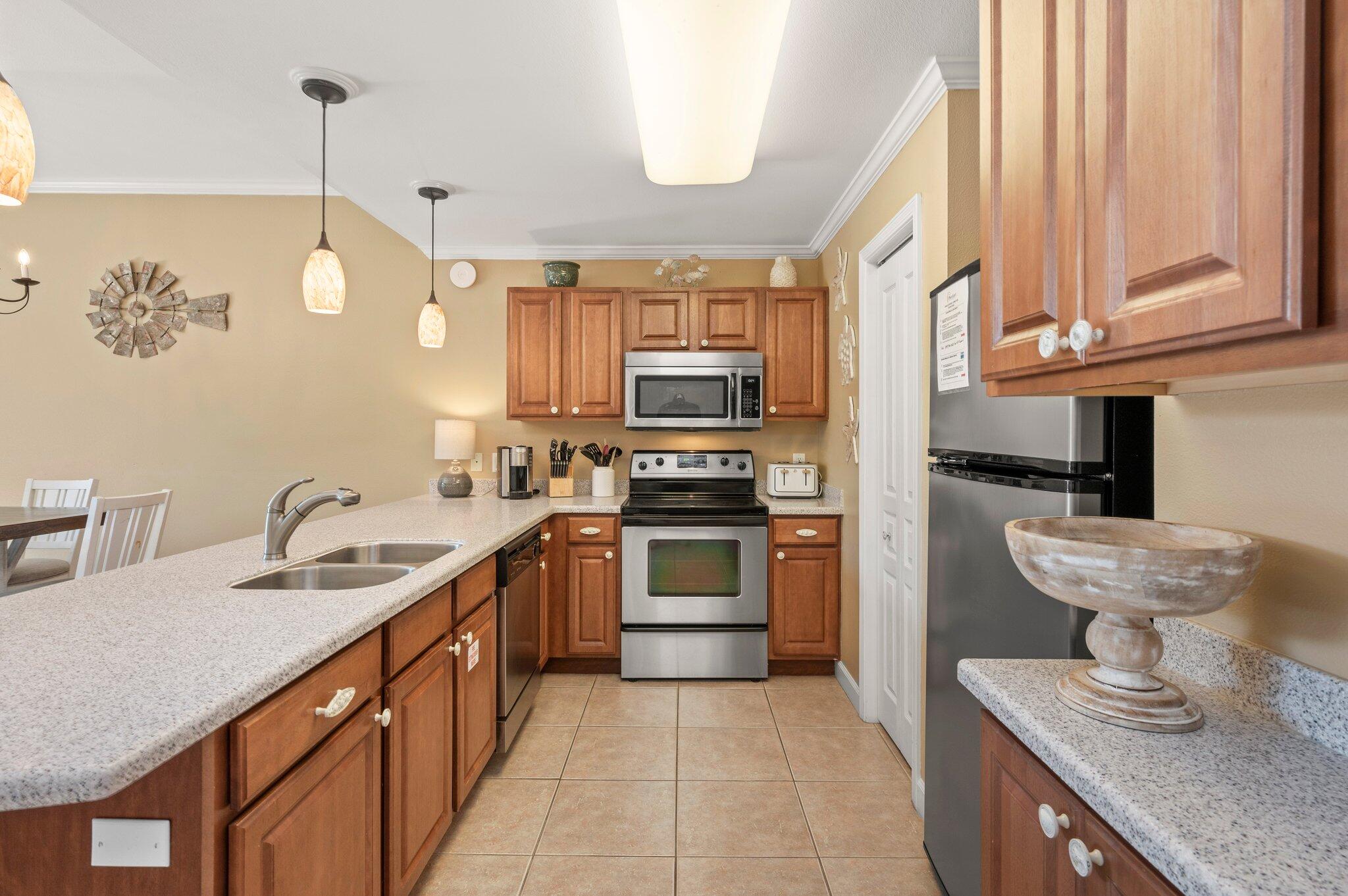 548 Sandy Cay Drive, Unit 203 Miramar Beach, FL 32550 - Photo 19 of 48 a kitchen with a sink stove and microwave