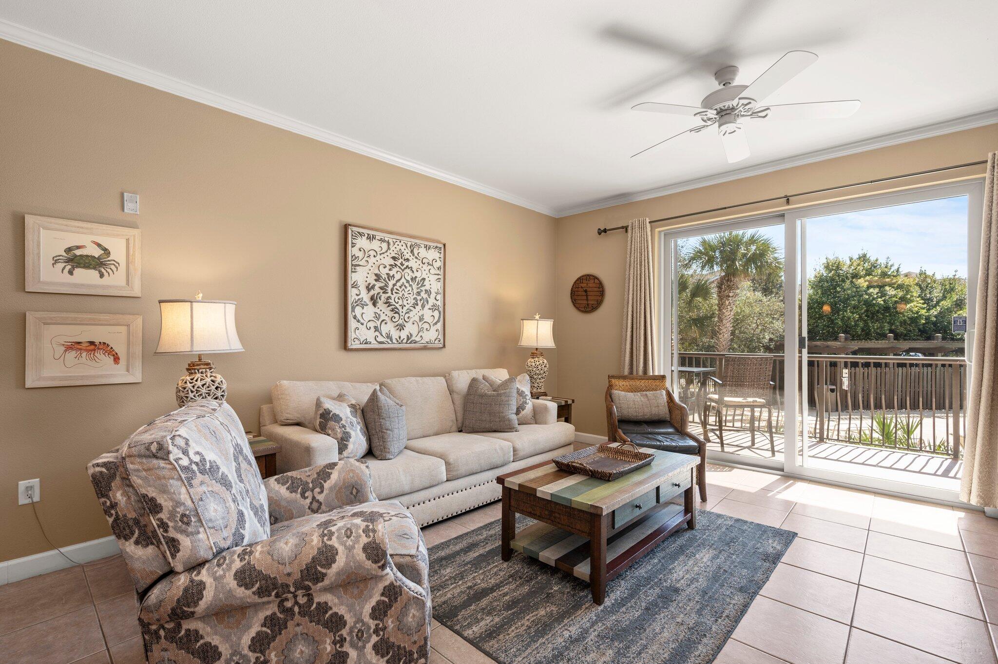548 Sandy Cay Drive, Unit 203 Miramar Beach, FL 32550 - Photo 21 of 48 a living room with furniture and a large window
