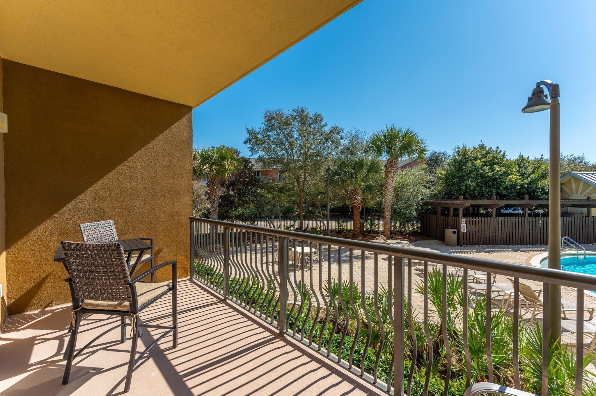 548 Sandy Cay Drive, Unit 203 Miramar Beach, FL 32550 - Photo 38 of 48 a view of balcony with wooden floor and outdoor seating