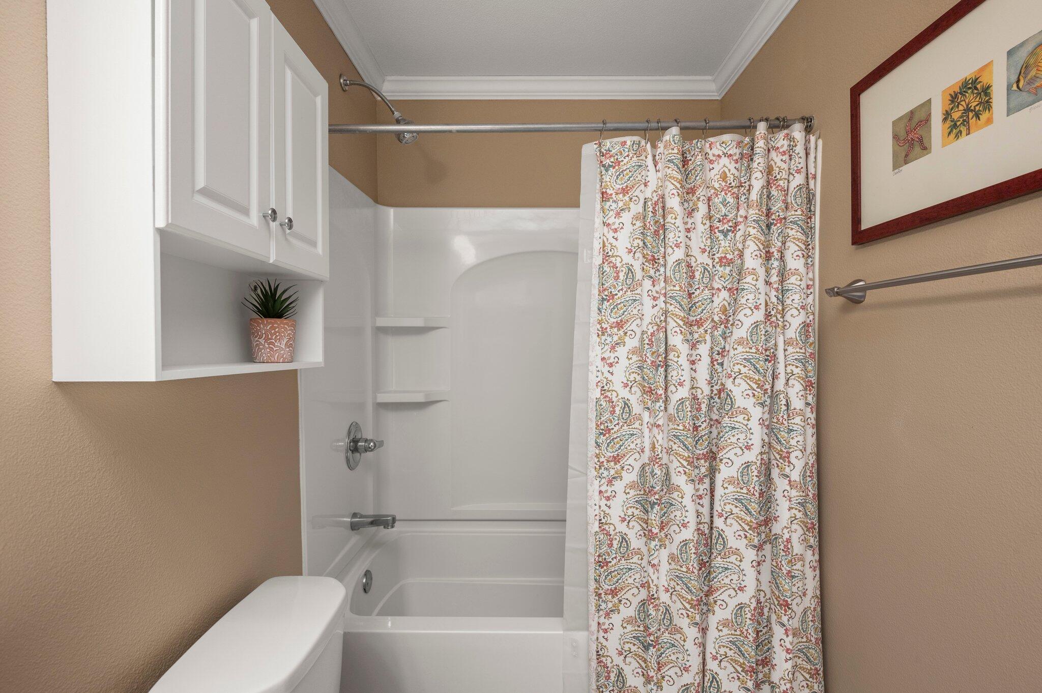 548 Sandy Cay Drive, Unit 203 Miramar Beach, FL 32550 - Photo 8 of 48 a bathroom with a toilet and shower