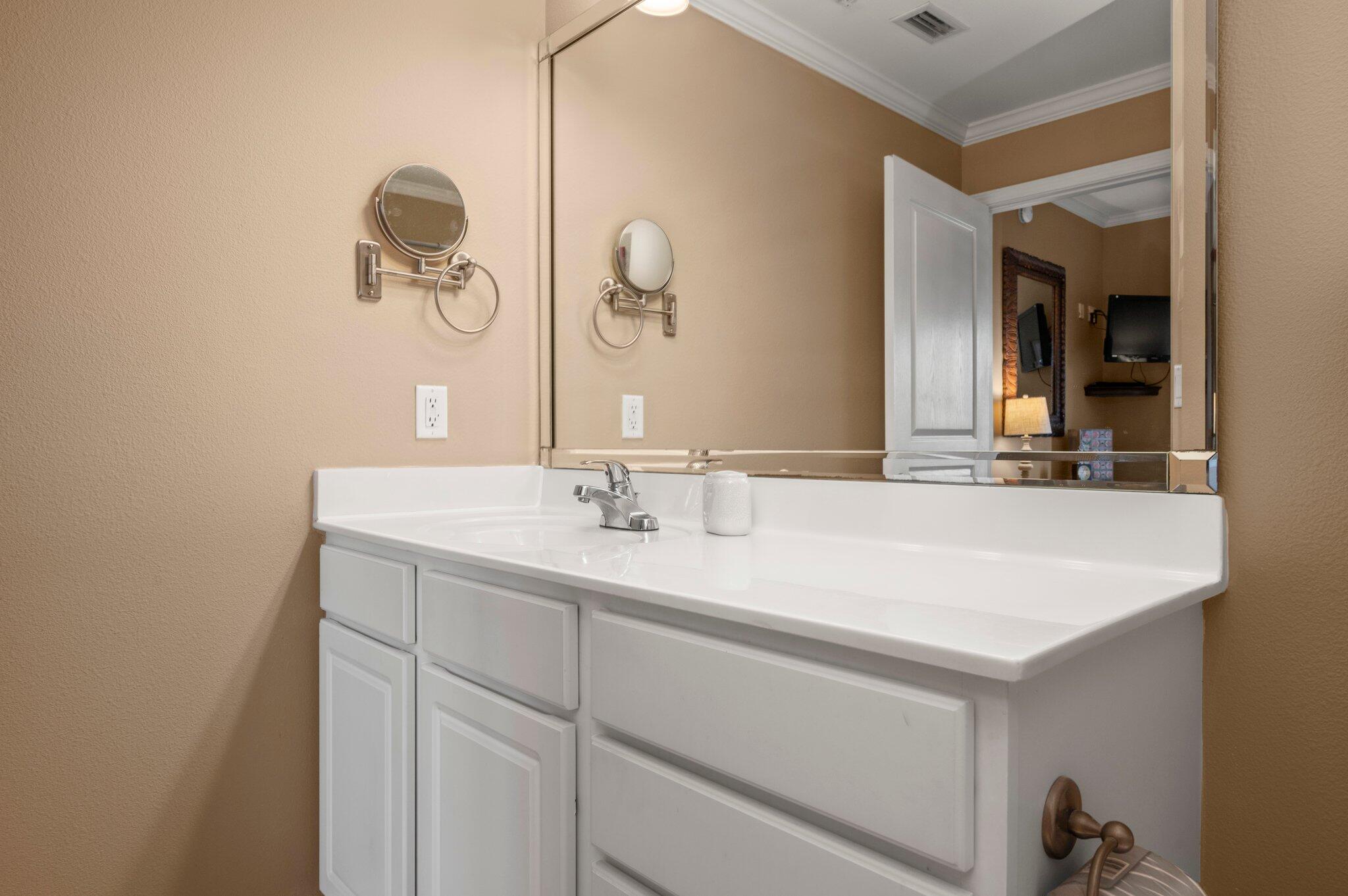 548 Sandy Cay Drive, Unit 203 Miramar Beach, FL 32550 - Photo 9 of 48 a bathroom with a sink and a mirror