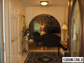 16040 Samoa Court Tega Cay, SC 29708 - Photo 2 of 8 a living room with a couch and a table