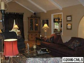 16040 Samoa Court Tega Cay, SC 29708 - Photo 4 of 8 a living room with furniture and a wooden floor
