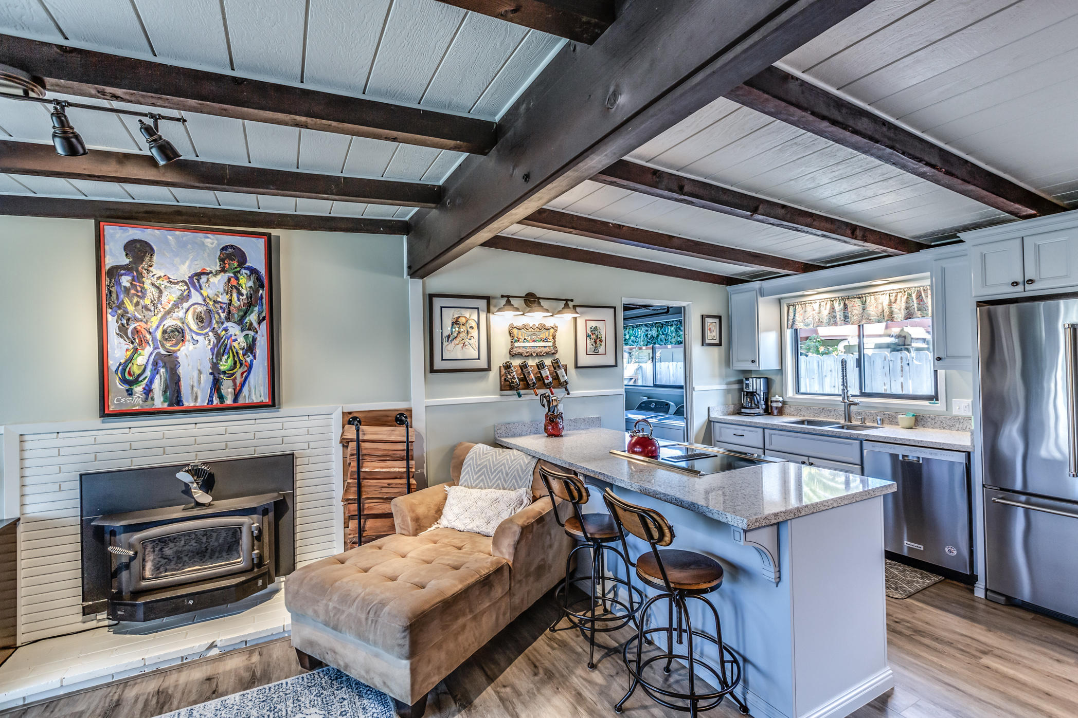 3372 Edgewood Road Myrtletown, CA 95501 - Photo 13 of 44 a open kitchen with stainless steel appliances granite countertop a stove a refrigerator a sink dishwasher a dining table and chairs with wooden floor