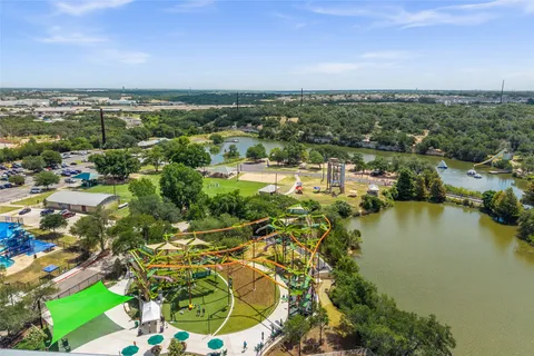 a view of a park with large trees