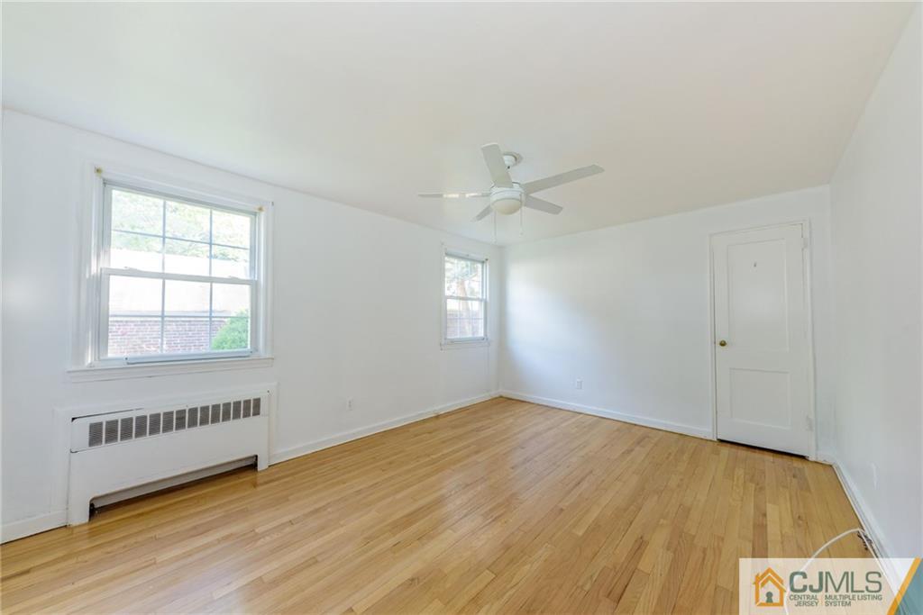 445 Morris Avenue, Unit D5 Springfield, NJ 07081 - Photo 15 of 21 wooden floor in an empty room with a window