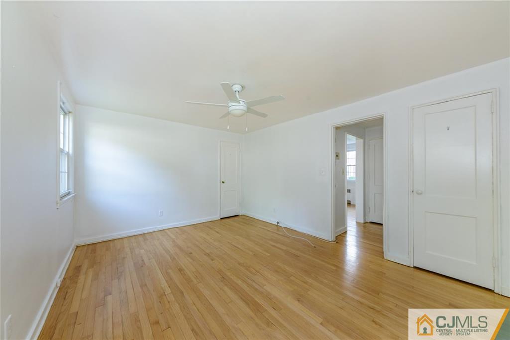 445 Morris Avenue, Unit D5 Springfield, NJ 07081 - Photo 16 of 21 a view of an empty room with wooden floor