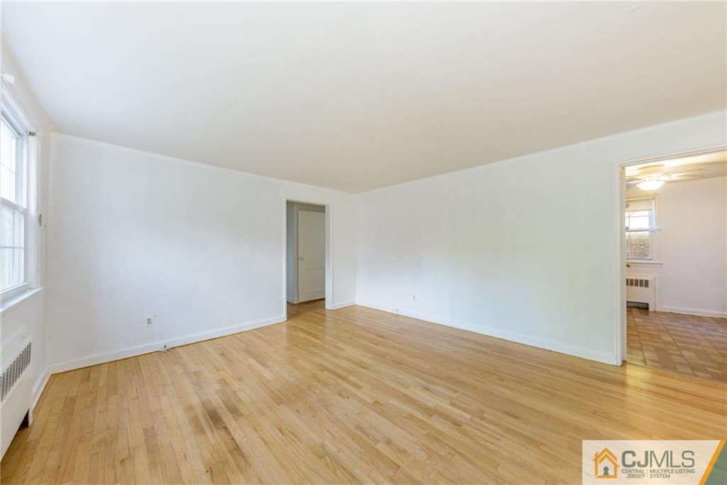 445 Morris Avenue, Unit D5 Springfield, NJ 07081 - Photo 19 of 21 a view of an empty room and window