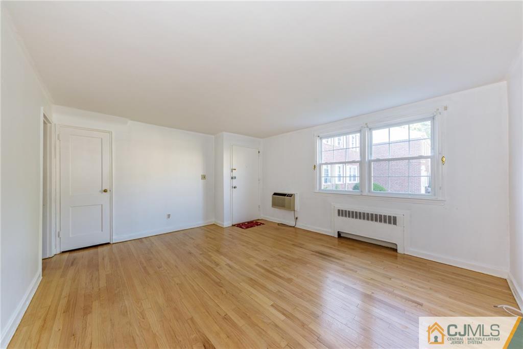445 Morris Avenue, Unit D5 Springfield, NJ 07081 - Photo 5 of 21 a view of an empty room and window