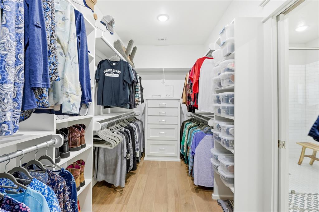 245 La Cresta Lane Perrin, TX 76486 - Photo 18 of 40 a view of walk in closet with clothes