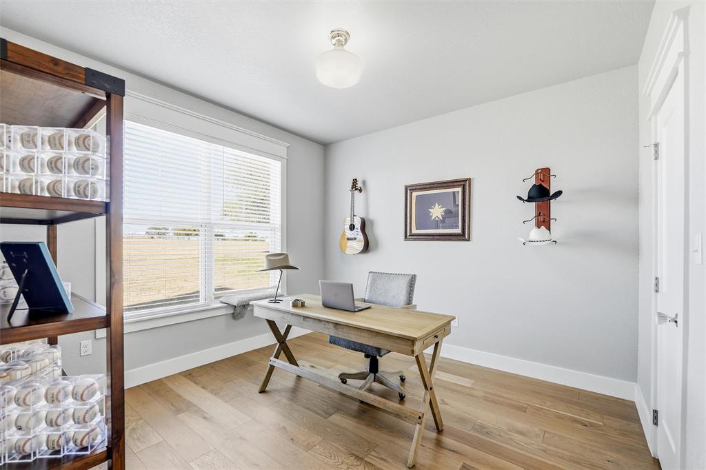 245 La Cresta Lane Perrin, TX 76486 - Photo 25 of 40 a workspace with wooden floor and a window