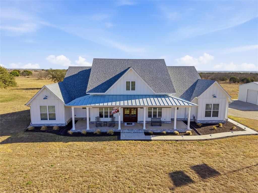 245 La Cresta Lane Perrin, TX 76486 - Photo 39 of 40 a large building with a large pool in front of it